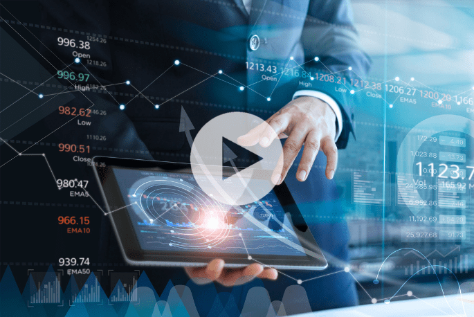 A person in a suit uses a tablet displaying graphs and data analytics, with overlaid financial charts and stock market statistics in the background.