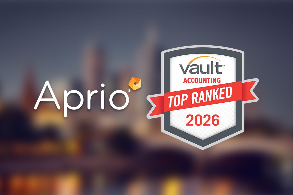 The image shows the Aprio logo next to a Vault Accounting Top Ranked 2026 badge on a blurred cityscape background.