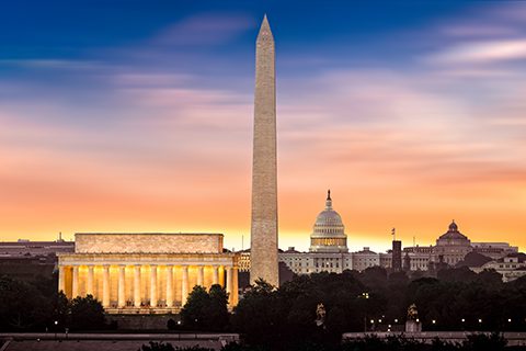 The Lincoln Memorial, Washington Monument, and U.S. Capitol are pictured at sunset in Washington, D.C.