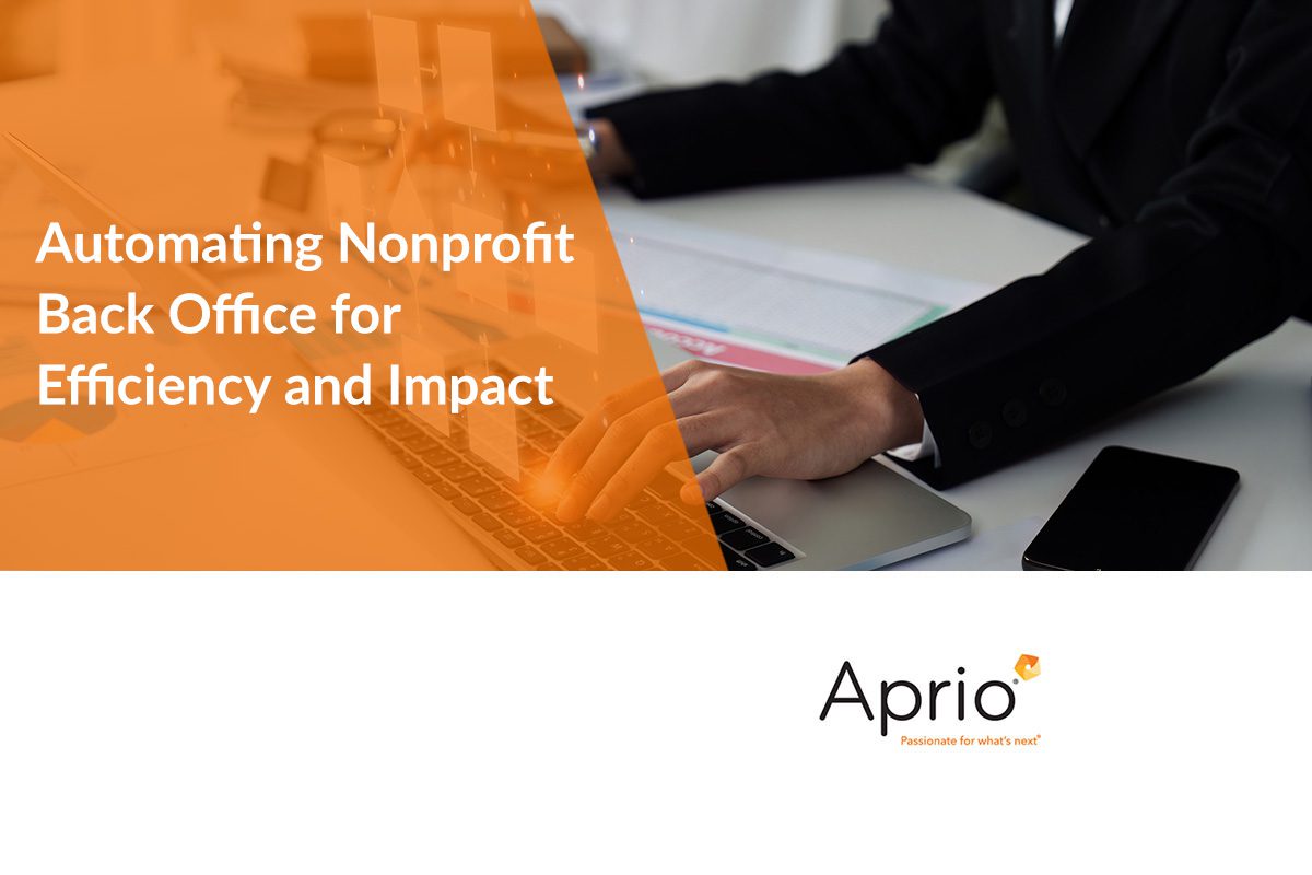 A person types on a laptop at a desk with documents; text reads Automating Nonprofit Back Office for Efficiency and Impact. Aprio logo is in the bottom right corner.