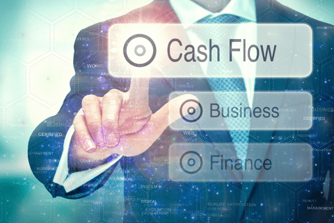 A person in a suit selects Cash Flow on a transparent virtual interface, with Business and Finance options also displayed.