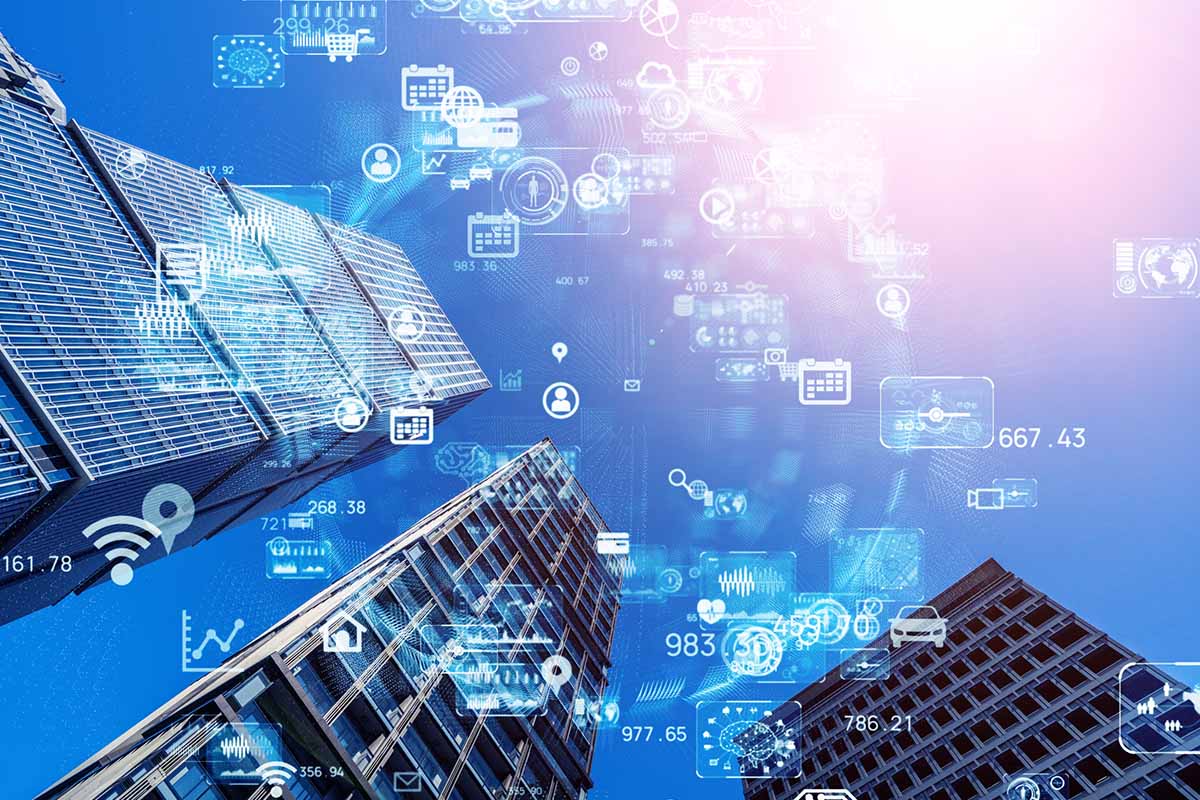 Skyscrapers viewed from below with digital technology and data icons superimposed in the sky, suggesting smart city concepts and modern urban connectivity.