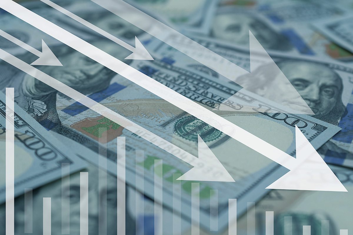 Several 100-dollar bills in the background with white downward arrows and bar graph overlays, symbolizing financial loss or economic decline.