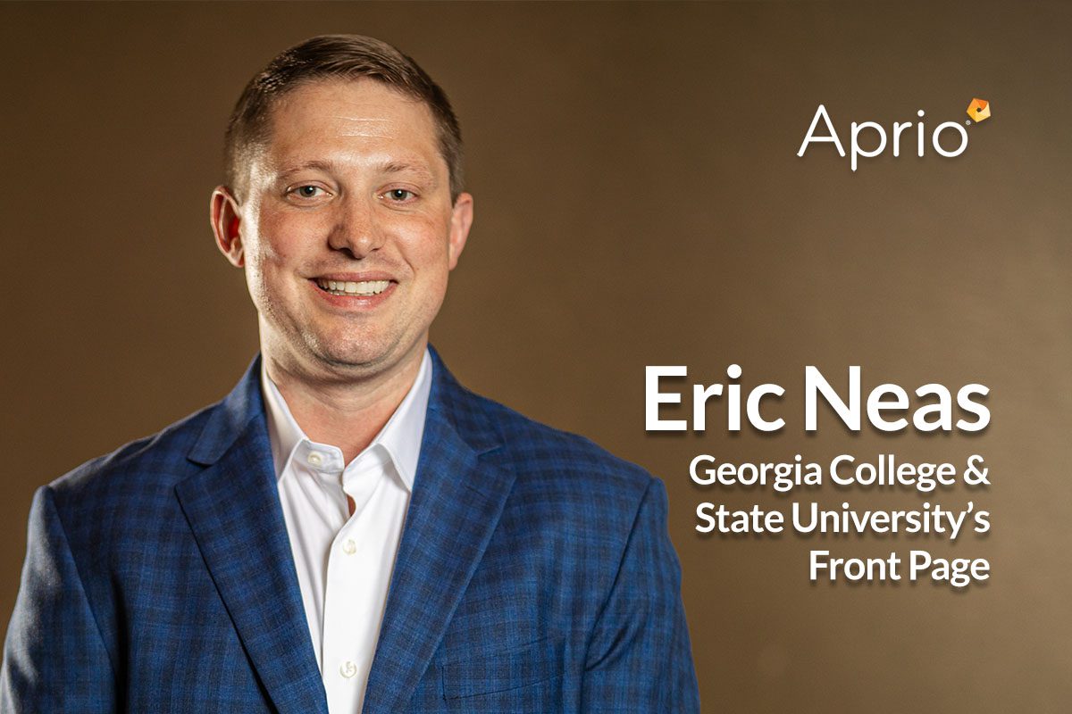 A man in a blue checked jacket and white shirt smiles at the camera. Text reads: Eric Neas, Georgia College & State Universitys Front Page, Aprio.