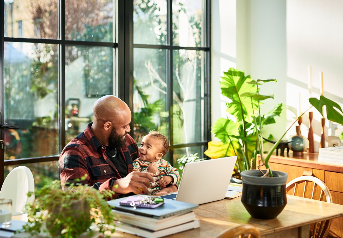 Father and baby with laptop