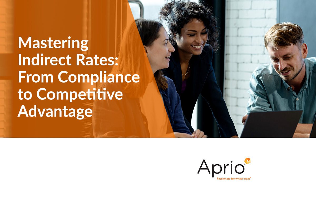 Three people sit together at a table with a laptop, smiling and talking. Text on the image reads, Mastering Indirect Rates: From Compliance to Competitive Advantage.