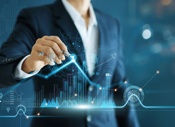 A person in a suit interacts with digital financial graphs and charts, symbolizing data analysis and business growth.
