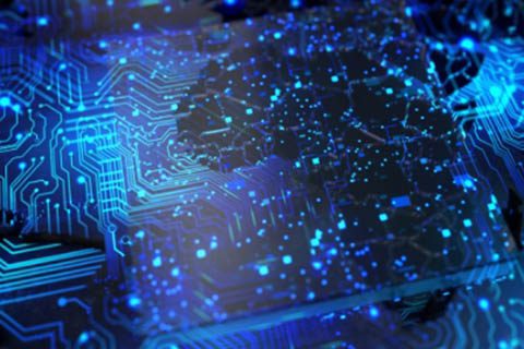 A close-up view of a blue-lit electronic circuit board with numerous lines and nodes, representing digital technology and connectivity.