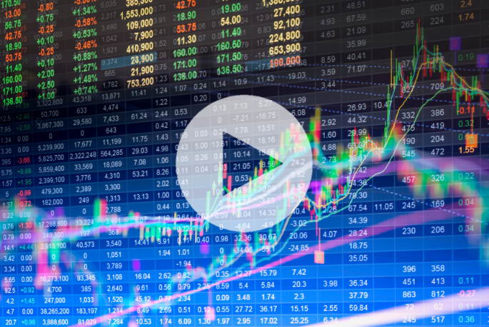 Digital screen displaying stock market data, including numbers, graphs, and candlestick charts, with a large play button overlay in the center.
