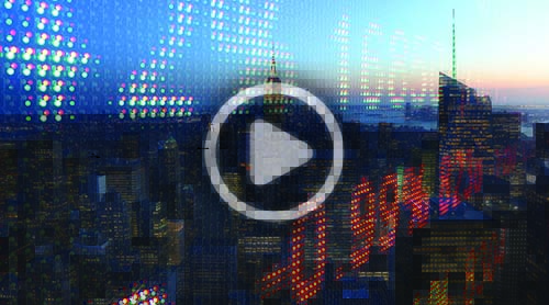 A city skyline at dusk overlaid with digital stock market numbers and a prominent play button centered on the image.