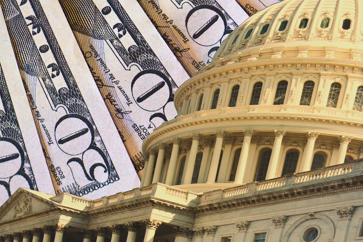Close-up of the U.S. Capitol building with overlapping $50 bills in the background, symbolizing government and finance.