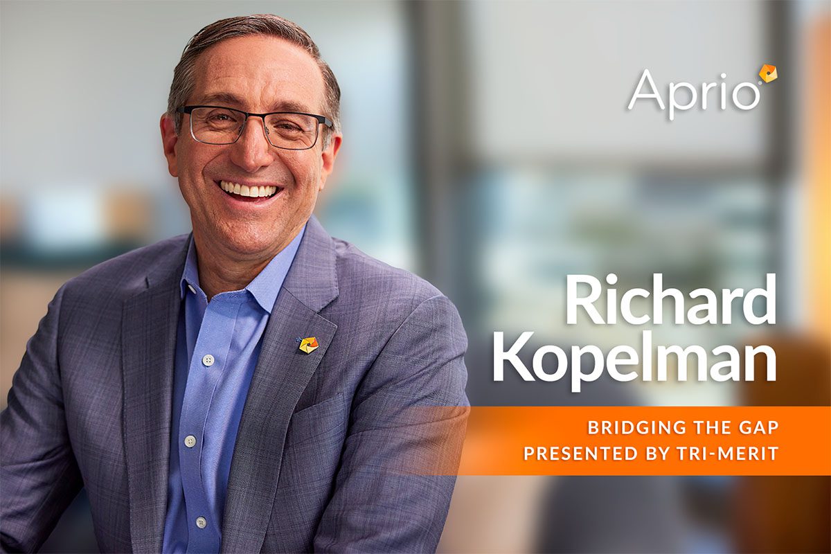A man in a blue suit and glasses, smiling, seated in an office. Text reads: Richard Kopelman, Bridging the Gap, Presented by Tri-Merit, Aprio.