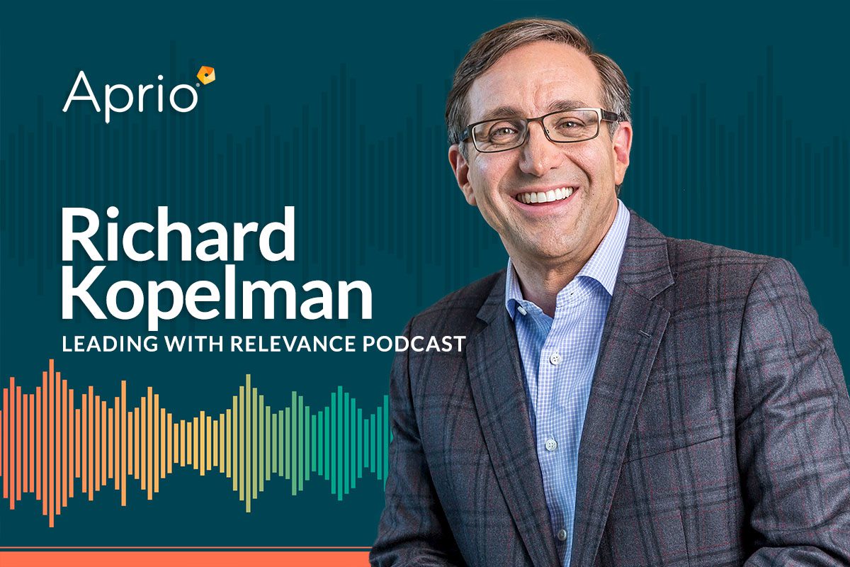A man in a plaid suit jacket and glasses smiles next to text reading Richard Kopelman, Leading with Relevance Podcast and the Aprio logo on a blue background.