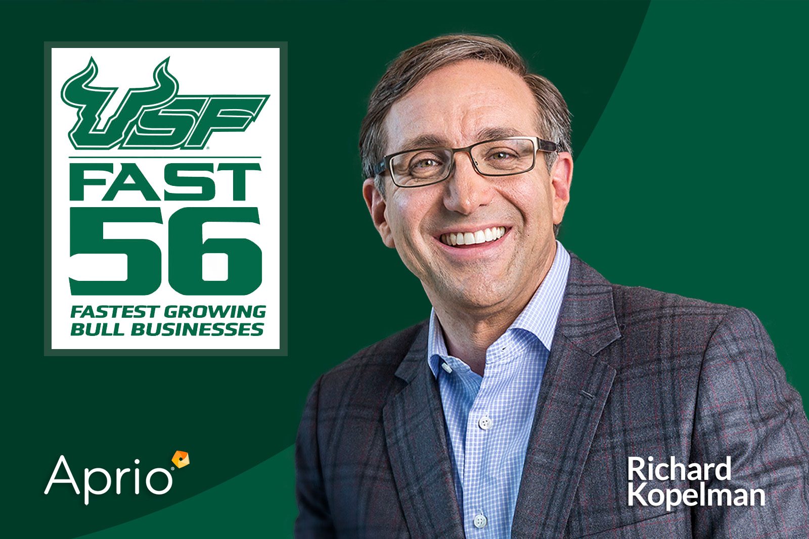 Smiling man in a suit poses next to a sign reading USF Fast 56 Fastest Growing Bull Businesses. Aprio and Richard Kopelman logos are displayed.
