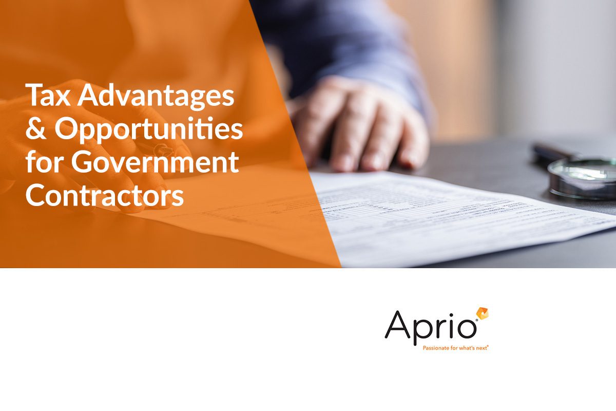 A person reviews documents on a table; text reads Tax Advantages & Opportunities for Government Contractors with the Aprio logo at the bottom.