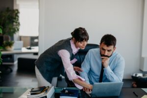 Worried and unworried partners at the office