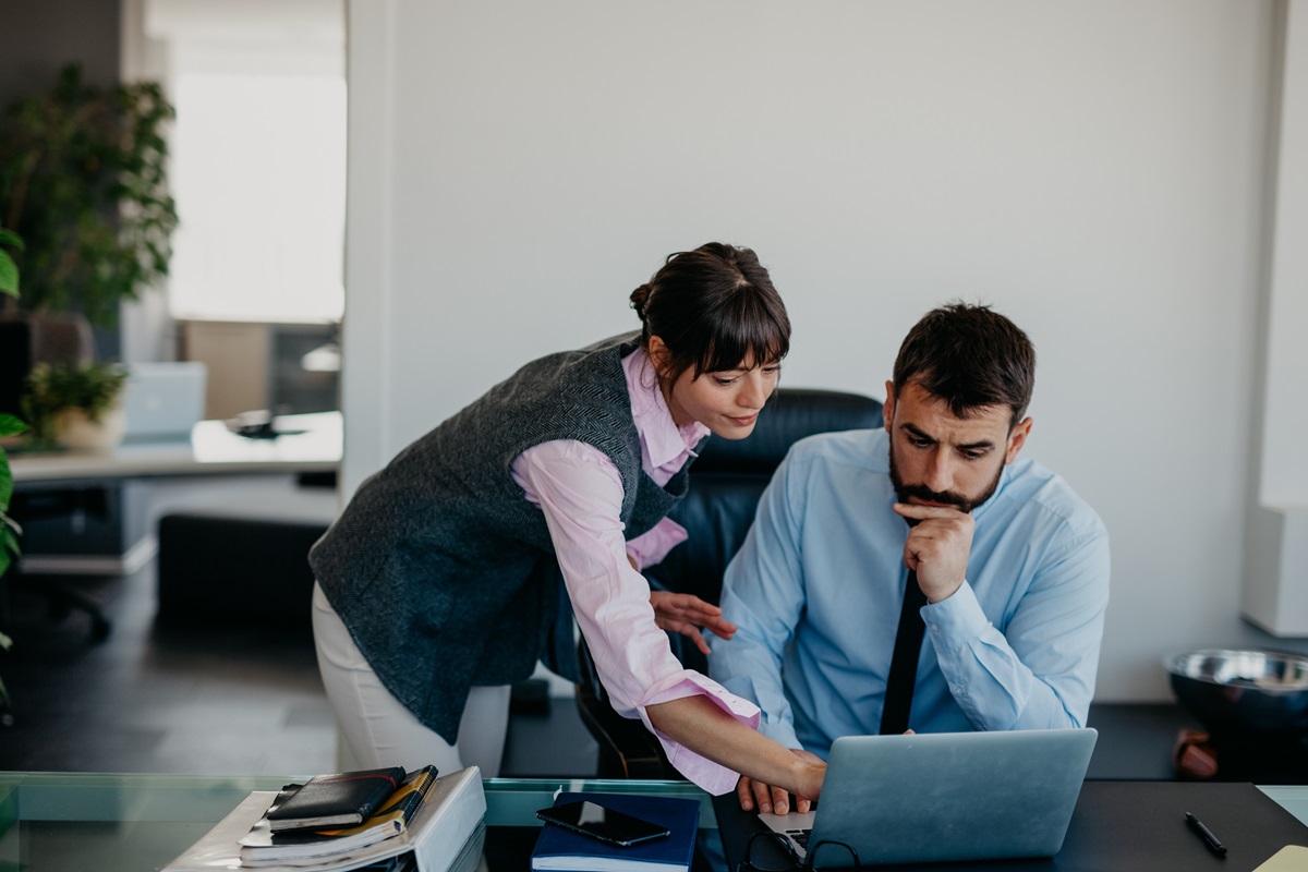 Worried and unworried partners at the office