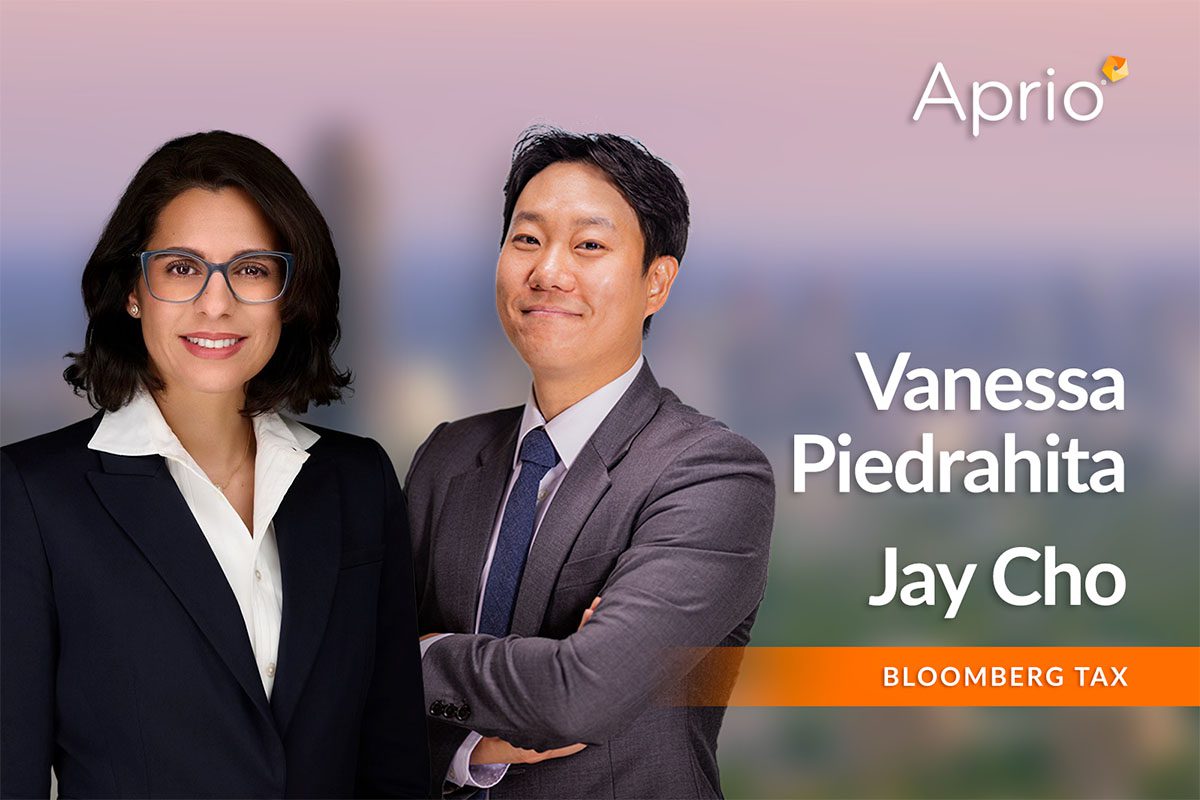 Two business professionals, a woman and a man in suits, stand side by side with the names Vanessa Piedrahita and Jay Cho, and the logos Aprio and Bloomberg Tax displayed.