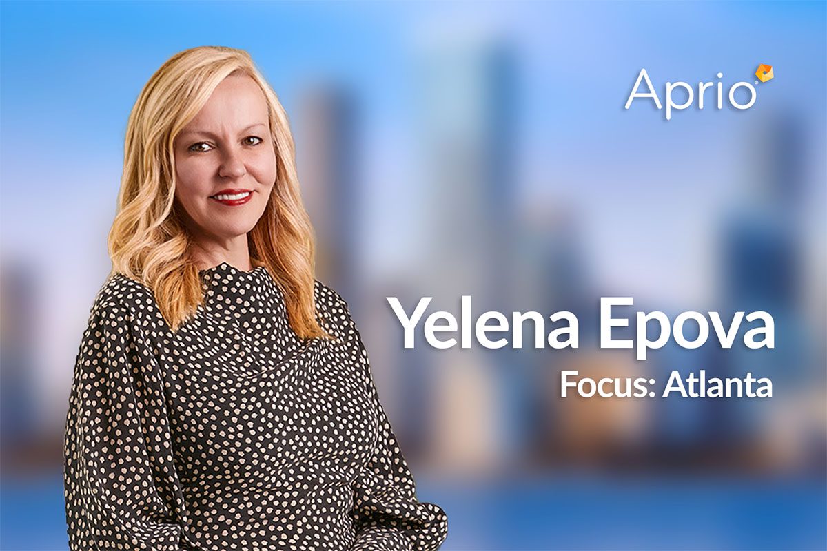 A woman with blonde hair stands in front of a blurred cityscape. Text reads: Aprio. Yelena Epova. Focus: Atlanta.