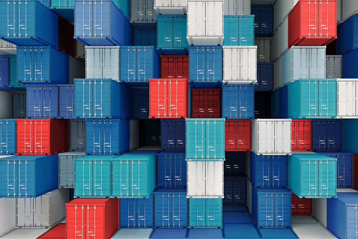 Stacked shipping containers in blue, red, and white colors, arranged in a dense grid pattern, viewed from the front.