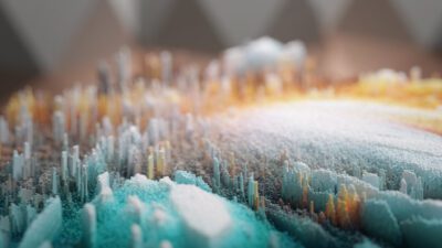 A close-up view of a colorful abstract 3D landscape composed of vertical rectangular shapes in blue, orange, and white tones.