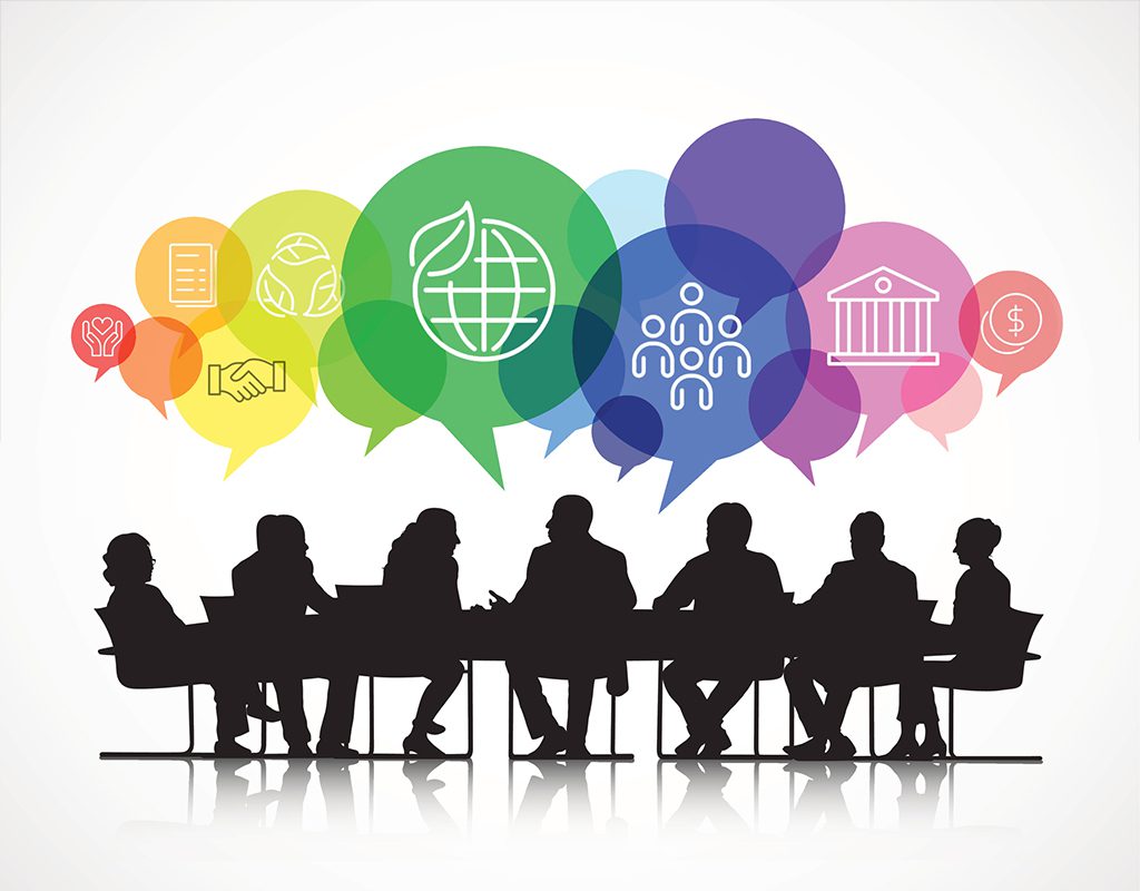 Silhouetted group of people sitting at a conference table with colorful speech bubbles and icons representing various topics above their heads.