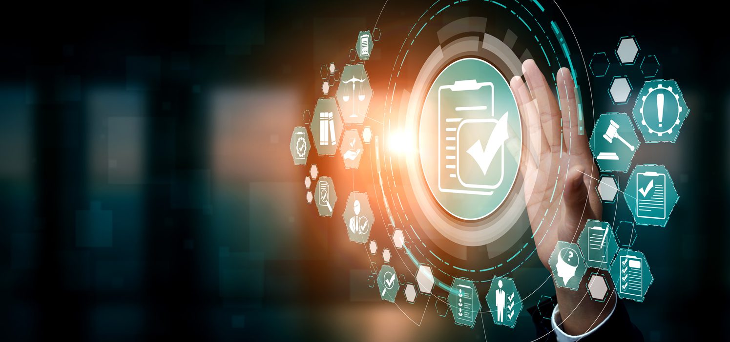 A hand interacts with a digital interface displaying a large clipboard and checkmark icon, surrounded by various technology and data icons on a dark background.