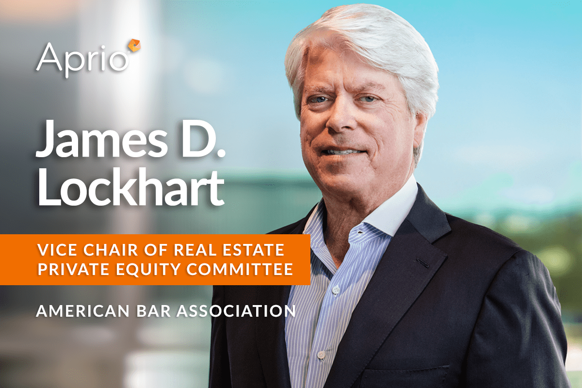 A man in a suit stands smiling, with text identifying him as James D. Lockhart, Vice Chair of Real Estate Private Equity Committee, American Bar Association, under the Aprio logo.