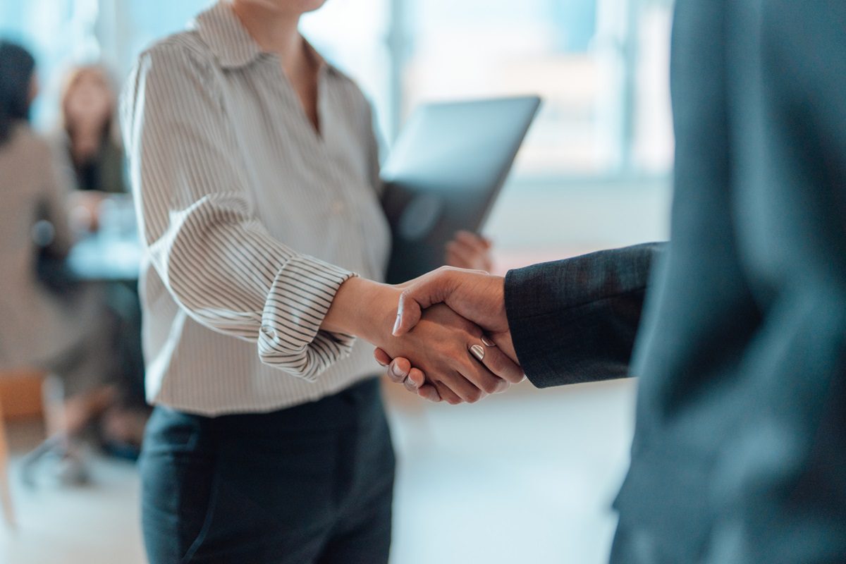Cropped shot of business people standing in a modern office, shaking hands after having a successful meeting and reaching an agreement. Welcoming new hire. Celebrating success and achievement.
