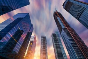 Low angle view of modern financial skyscrapers rising straight up against dramatic sky in downtown Toronto