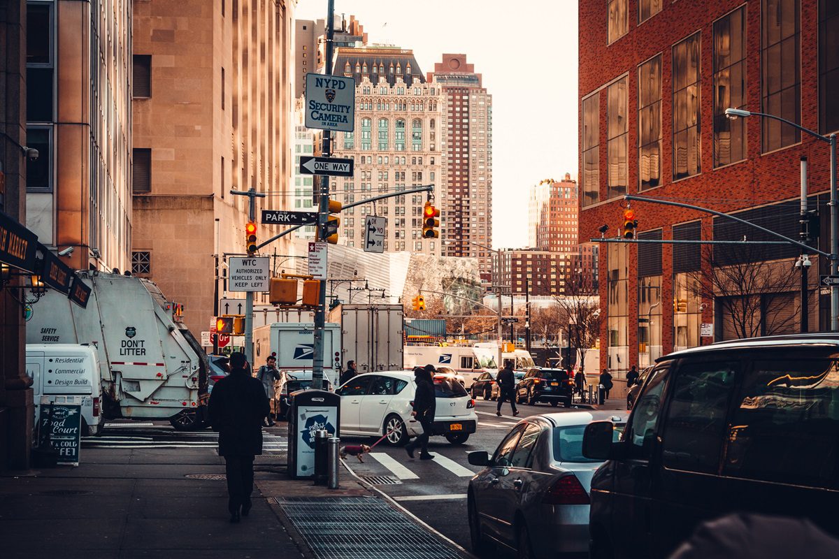 People walking on sidewalk. Street traffic in Lower Manhattan. New York. USA. January 2018