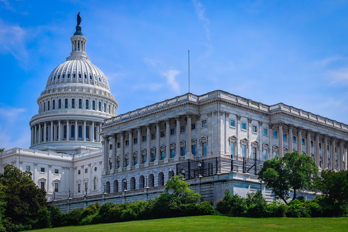 The United States capitol building in Washington DC on a summer day.