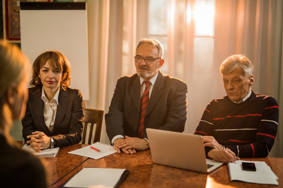 Nonprofit board members meeting to discuss an unusual grant.