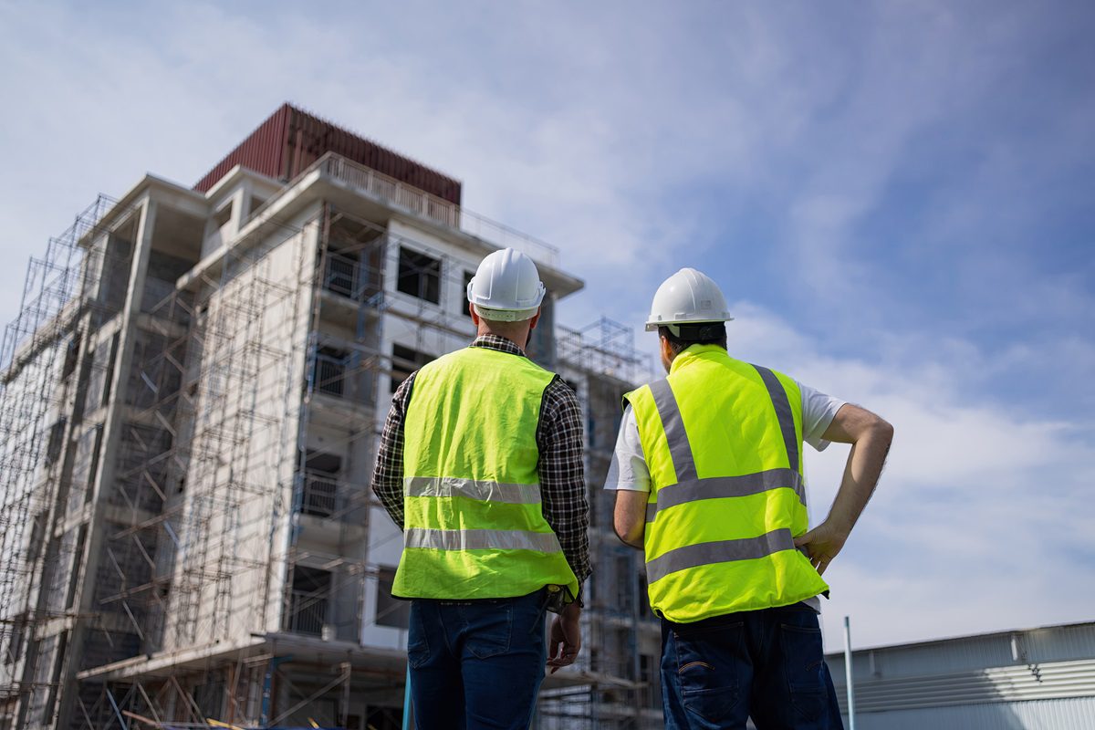 The engineers in the workplace are inspecting the specifications of buildings, apartments, and residences.