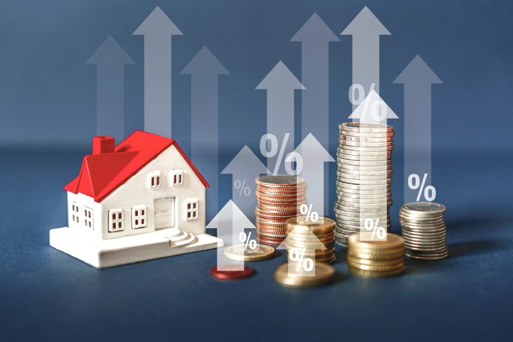 A model house next to a pile of coins and a rising bar graph symbolizes the financial growth of real estate investment, real estate, financial growth. Real estate business growth trends