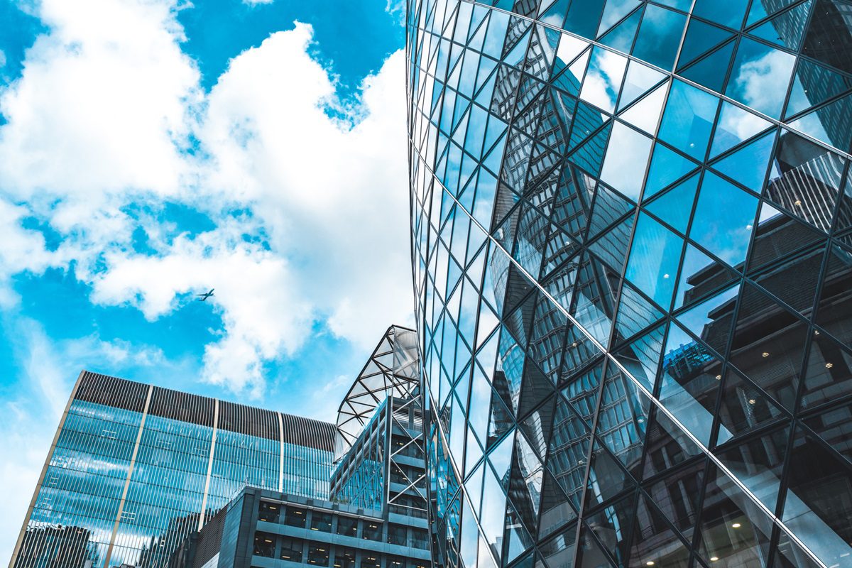 Low angle view of modern buildings against sky in London