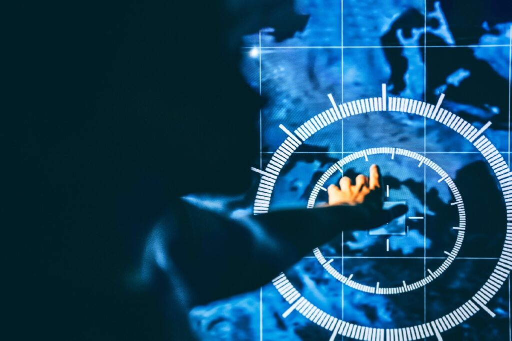 Hand touching a glowing circular interface over a blue world map, suggesting data security across a global network.