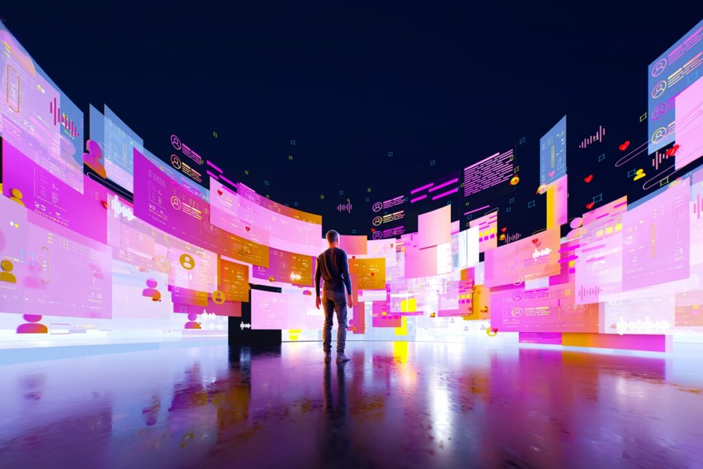 Digital generated image of young man in empy black space with semi reflective floor surrounded by multicoloured semi transparent data screens.