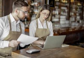 Cafe owners accounting in a coffee shop