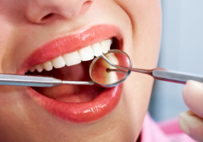 Close up of a smile with dental equipment