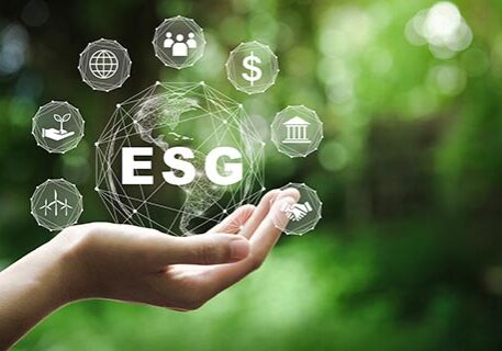 decorativeESG icon concept in the hand for environmental, social, and governance in sustainable and ethical business on the Network connection on a green background.
