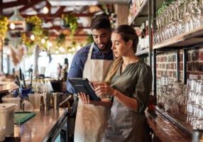 Tablet, bartender or small business people for communication, networking or online order check. Research, planning startup or teamwork for inventory checklist, stock management or social media review