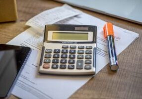 Calculator with bill, smartphone .Financial Concept