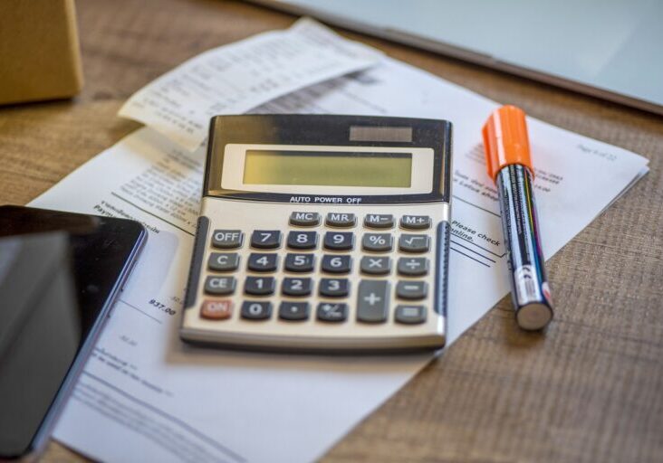Calculator with bill, smartphone .Financial Concept