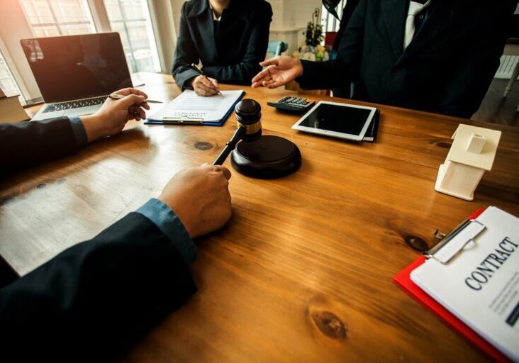 Group of business people and lawyers discussing contract papers ,Consultation between a male lawyer and businessman concept - stock photo