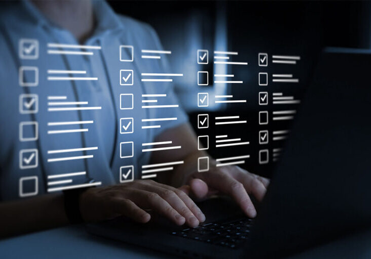 Businessman work at laptop doing online data checklist survey. Productivity checklist and filling survey form online. Fast checklist,clipboard task business management. - stock photo