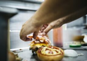 Chef preparing a cheeseburger