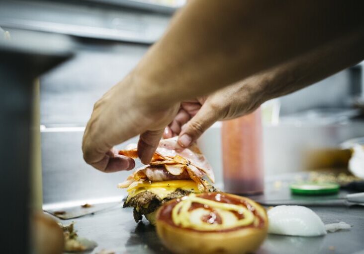 Chef preparing a cheeseburger