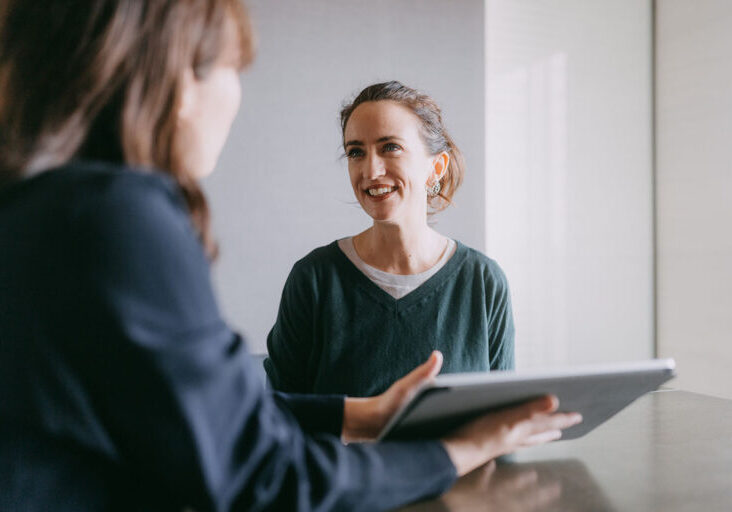 Woman meeting female banker for financial advice - stock photo