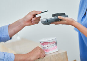 credit card transaction happening by model teeth